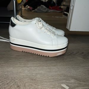 White and silver Steve Madden platform shoes